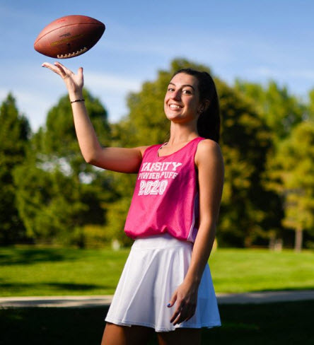 Artery impingement patient Ella Johnson outside with football