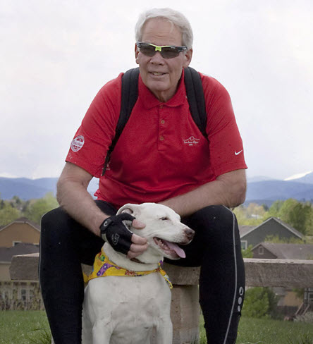 Atrial fibrillation patient Steven Rutledge poses with his dog on a park bench