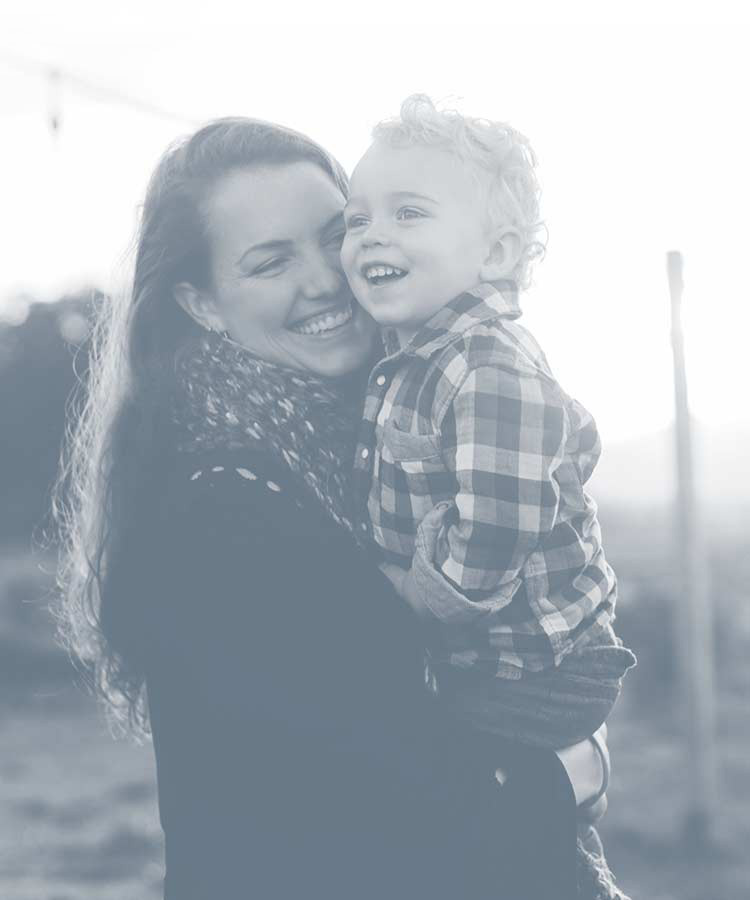 Woman holding young child