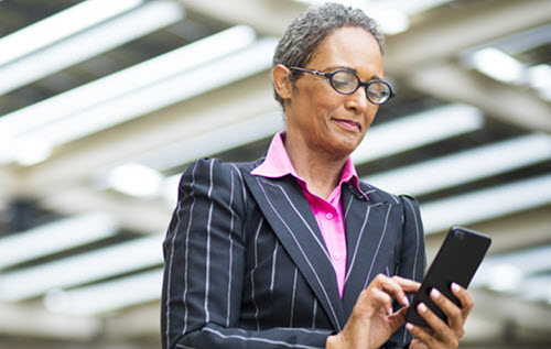 Woman executive using mobile phone