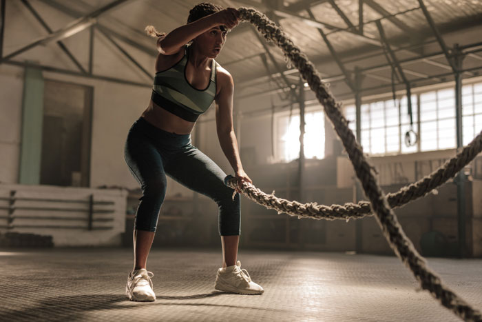 woman in training working on ropes