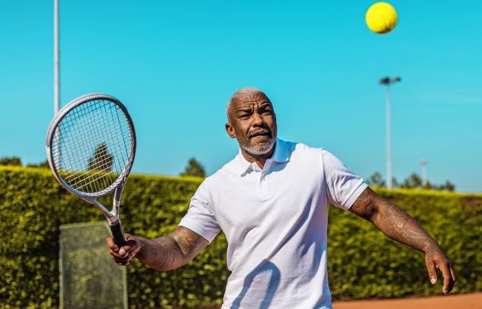 Tennis player ready to hit ball