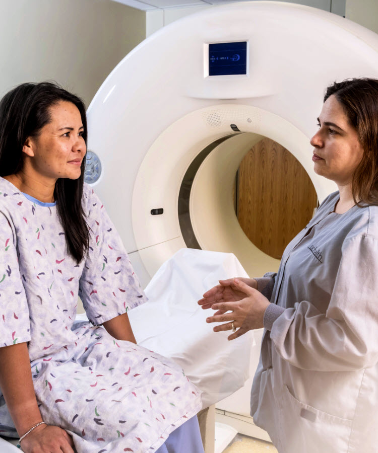 Female patient and CT imaging technician