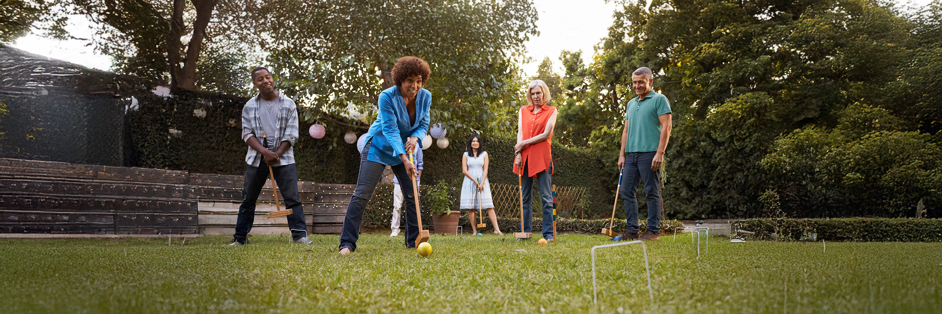 UCHealth Heart and Vascular group of adults playing croquet