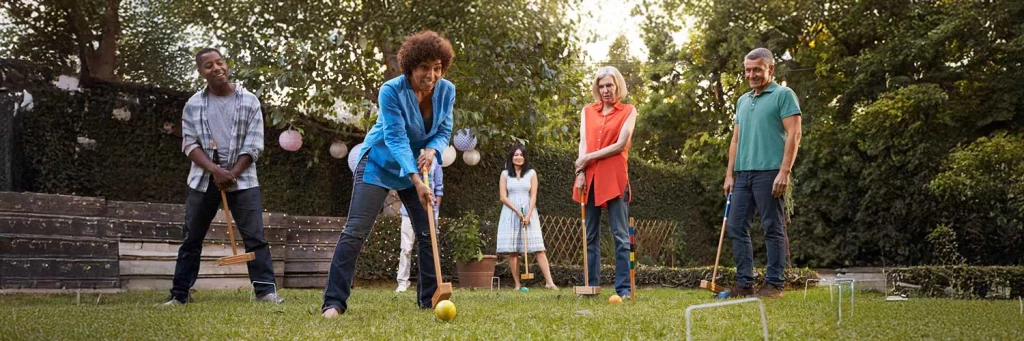 UCHealth Heart and Vascular group of adults playing croquet