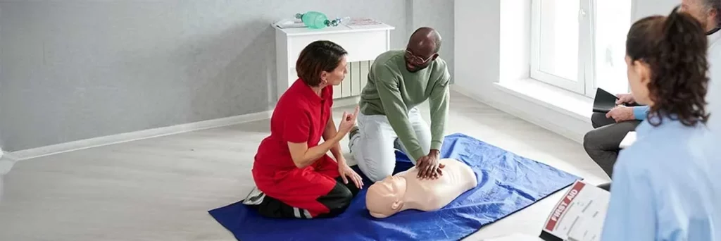 UCHealth how to save a life. CPR class with instructor and students.