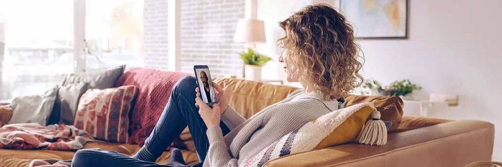 Woman at home on a UCHealth virtual video appointment.