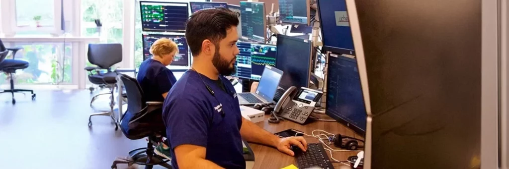 UCHealth Virtual Health. Man working at computer.