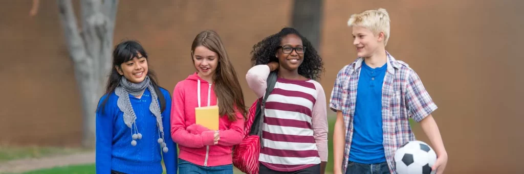 UCHealth Healthy Hearts and Minds kids walking outside of school