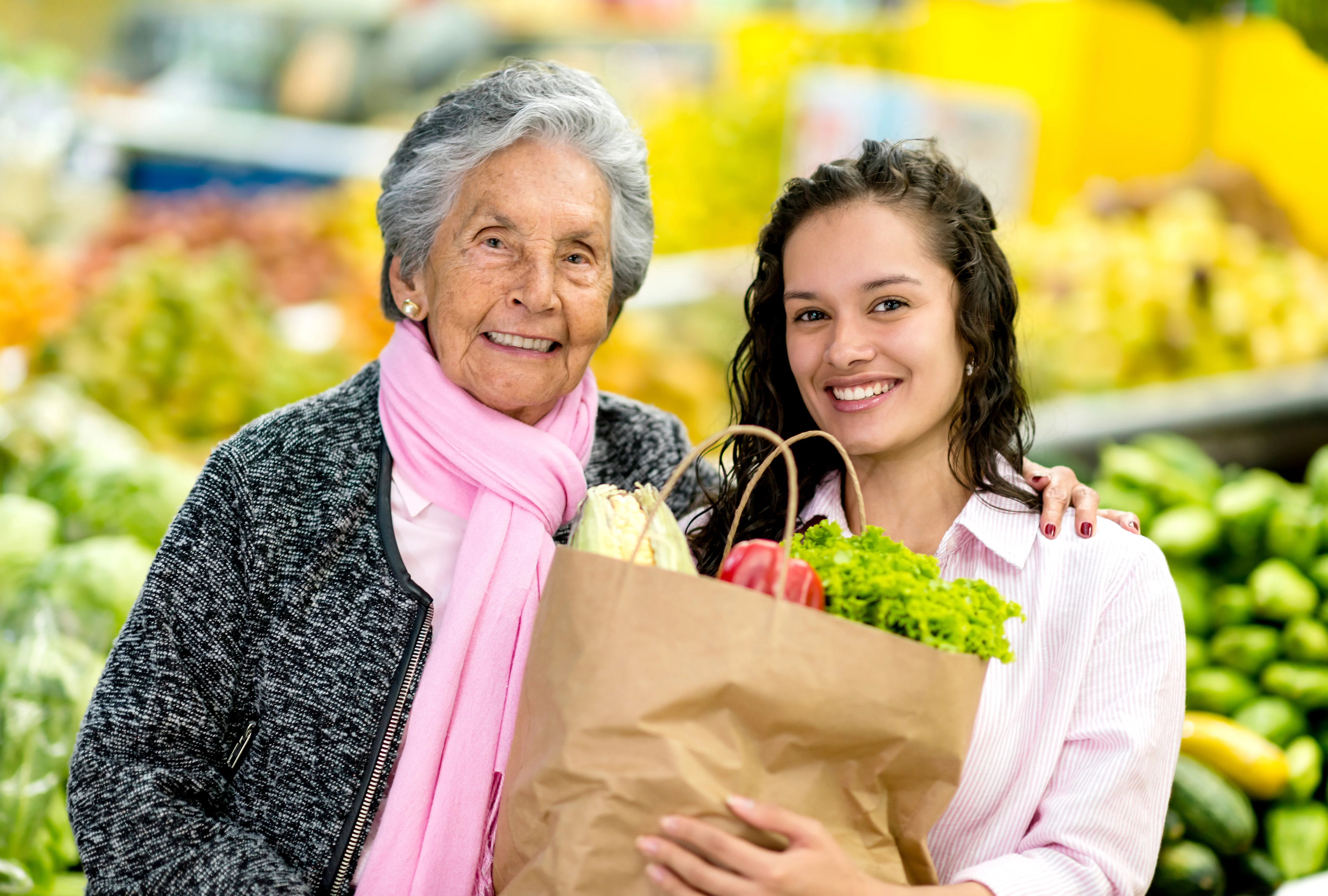UCHealth Healthy Hearts and Minds Family Program woman with grandmother carrying groceries.