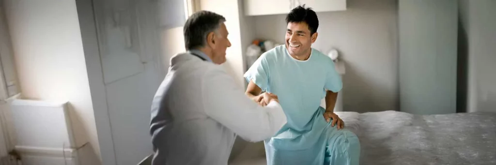 UCHealth Mobility patient with doctor in hospital room