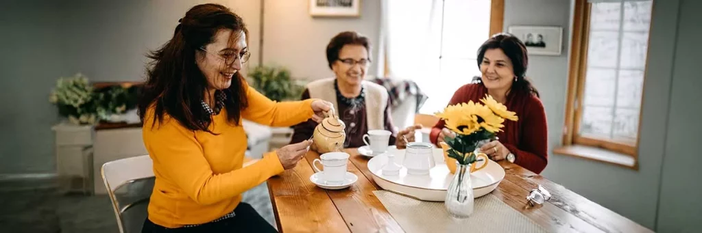 UCHealth friends enjoy tea at a dining table