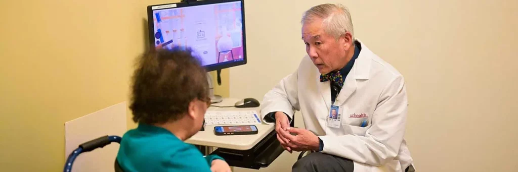 UCHealth provider using AI note taking during appointment with patient