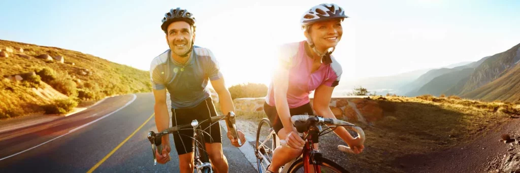 UCHealth New Employee Information couple biking in the mountains