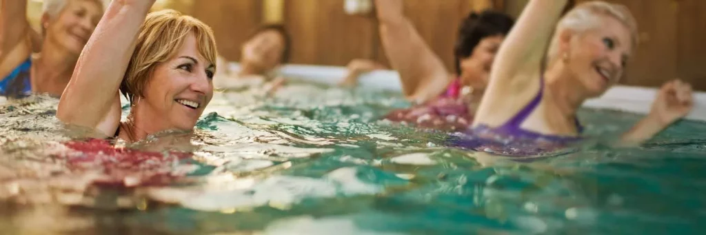 UCHealth Aesthetic services. Women doing water aerobics in pool.