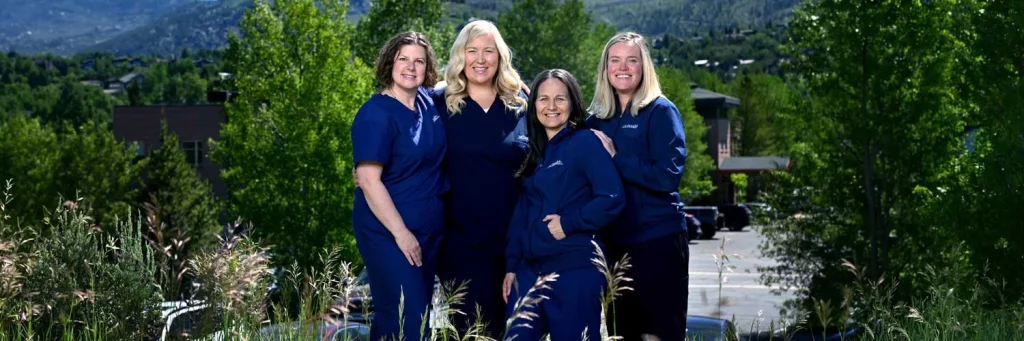 UCHealth YVMC nurses advance pediatric care in northwest Colorado. Group of nurses outside smiling at camera.