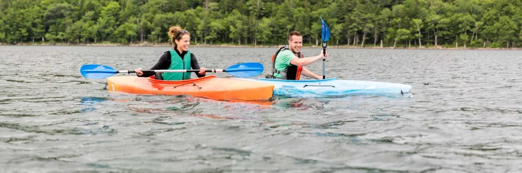 UCHealth Eye care cornea. Couple kayaking on a lake.