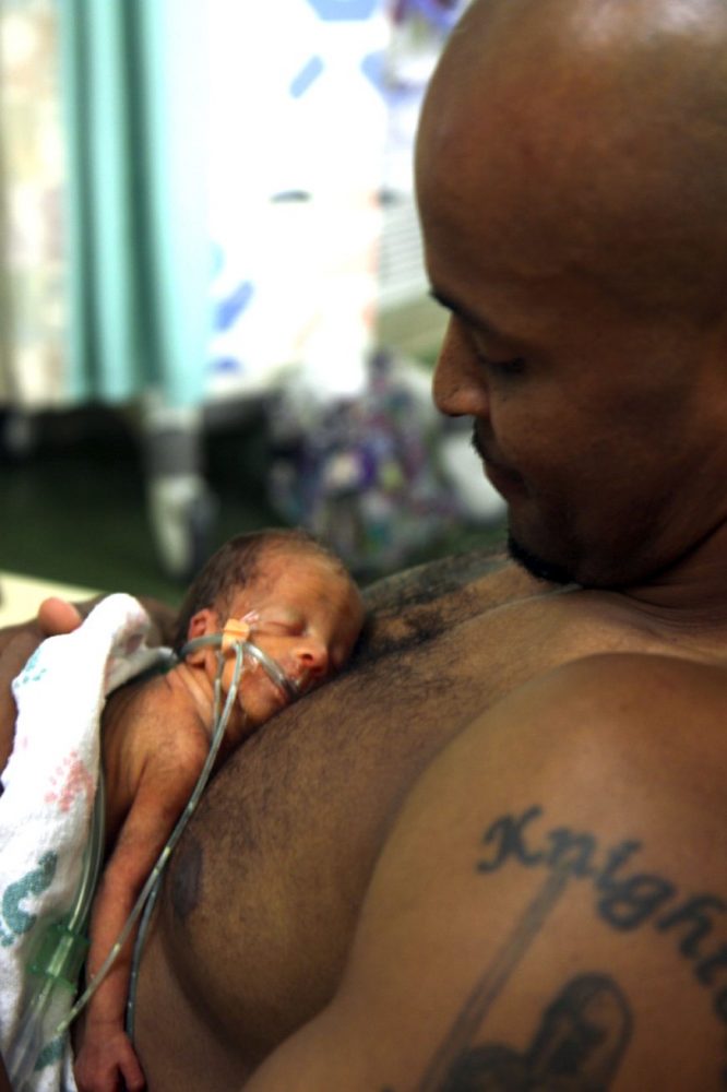 David Knighton holds his 1-week-old son, King David Knighton