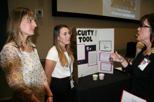 Maggie O’Connor (left) and Transplant Unit colleague Kelsey Christopoulos (center) with Carolyn Sanders.