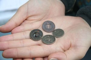 Music therapist Angela Wibben uses small coins to spark memories and reflections in patients.