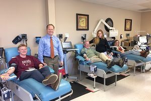 The Olsen family of Fort Collins decided they would show their thanks by donating in honor of their beloved Lois and those who donated to help sustain her life. From left, Garrett, Karl, Gerald, Heather and Ariane. Not pictured: Braden, Kari, Dan and Anders. Photo by Kati Blocker, UCHealth.