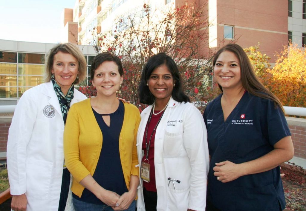 A patient pose with her oncology team.