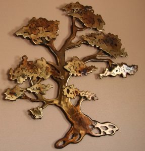 Intricately detailed metal tree reflects Flores attention to detail.