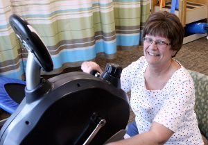 Deb Crites attends physical therapy at the Wellness Place at UCHealth Cancer Center in Fort Collins a few weeks after getting a shorter course of radiation therapy, made available to her through a clinical trial. Photo by Kati Blocker, UCHealth.