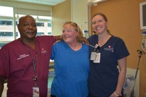 Kelley made a visit to her old room in the Burn/Trauma ICU Jan. 16. Left: Kelley with Rance Beasley, a burn technician, and Kelly Tuohy, charge nurse on the unit, both of whom cared for her during her 10-month stay at UCH.