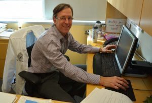 Greg Misky at his desk