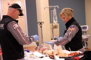 Duane Rorie and Leanna Harpman, both certified flight registered nurses with the UCHealth Critical Care Transport team and Air Link of Medical Center of the Rockies, are shown working on a "burn patient" during a simulation training at the UCHealth Clinical Education and Innovation Center..