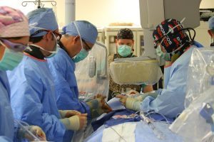 A team of UCHealth providers are shown in this photo performing a transcatheter aortic valve replacement procedure at UCHealth Medical Center of the Rockies in Loveland.