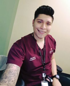This is a photo of Cris Romero Rangel, a certified medical assistant at UCHealth, who said UCHealth's statement on inclusion and a diversity represents a commitment to making patients feel at ease.