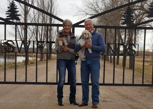 Jeanne and John Lambert are pictured with dogs Mollie and Ollie outside Colorado Youth Outdoors' Swift Ponds recreation center in Fort Collins.