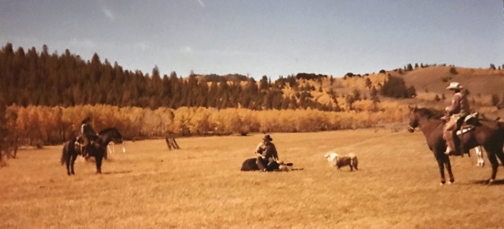 O. Rex Story, far right, helping his family on the ranch in this photo.