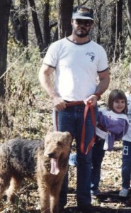 Nicole Caputo is shown hiking with her father and their family dog.