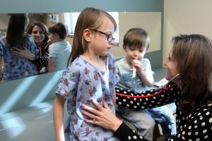 UCHealth Pediatrician Dr. Andrea Mead examines a patient.