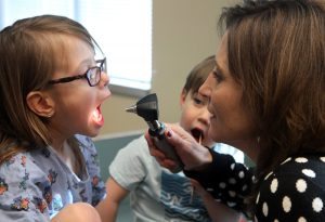 UCHealth Pediatrician Dr. Andrea Mead examines a patient.