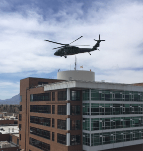A UH-60 Black hawk helicopter is shown practicing landing on the rooftop helipad at UCHealth Memorial Hospital Central.