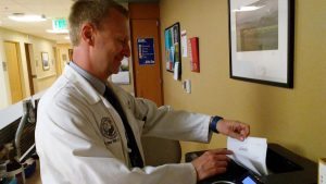 Matthew Taylor at work in the Adult Genetics Clinic at UCHealth UCH, which he directs. Taylor, who supervises the care of Tarryn Ford, says trials like the one she is enrolled in are slowly changing the way clinicians practice medicine