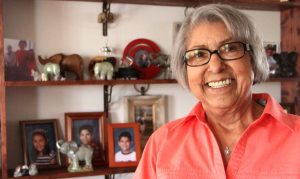 Florence Hampton's, 89, has had a 12-year battle with lung cancer. She poses here in her home with several family photos behind her.