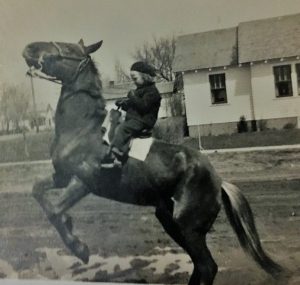 Sara Millard, as a little girl, in a black and white photo.