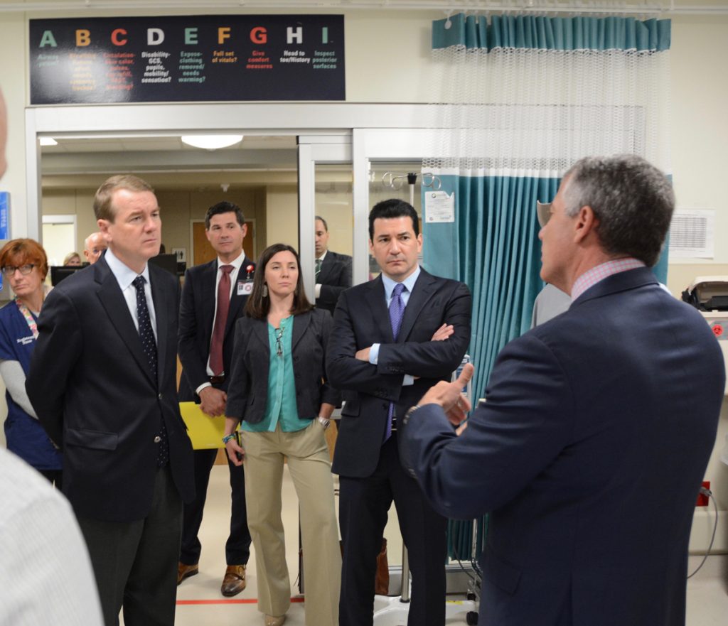 U.S. Sen. Michael Bennet, and Dr. Scott Gottlieb, the commissioner of the U.S. Food and Drug Administration, are shown during a visit to the University of Colorado Hospital emergency department.