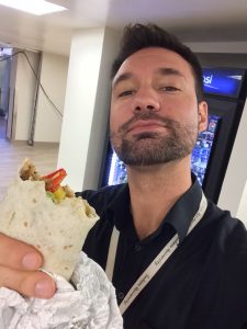 David Egerdahl, a registered dietitian and manager of patient services at UCHealth Memorial Hospital, holds up his health lunch in this photo.