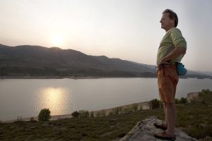 Randy Joseph looking out over Horsetooth Reservoir at sunset.