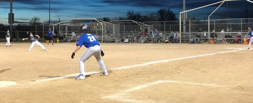 Brayden Tate playing baseball after a broken thumb.