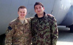 Staff Sgt. Kyle Sanchez, left, with an Afghan solider who he helped train for the Afghan Air Force airlift mission that provided relief operations to the country.