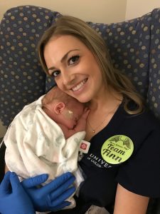 Finn snuggles with one of his nurses, Megan Jones.