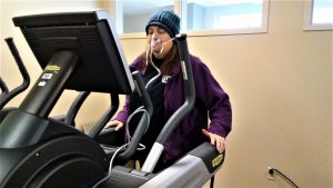 Erin M. is shown on an elliptical machine as part of her pulmonary rehabilitation at UCHealth University of Colorado Hospital.