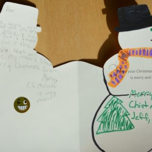 A snowman Christmas card shows a note from Melinda Ray to the children of her mom's liver donor. She wrote: “Your dad is the hero that will save my mom’s life. Merry Christmas from Mary. P.S. My mom is Melinda.”